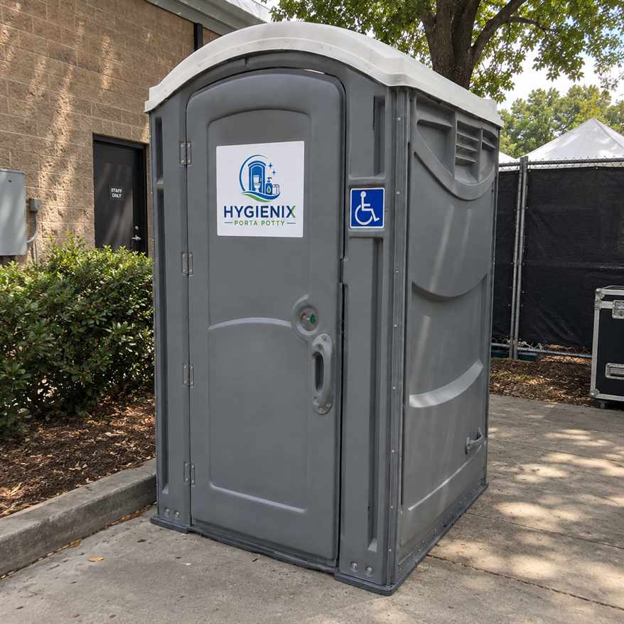 Hygienix Porta Potty ADA unit near shrubs and landscaping
