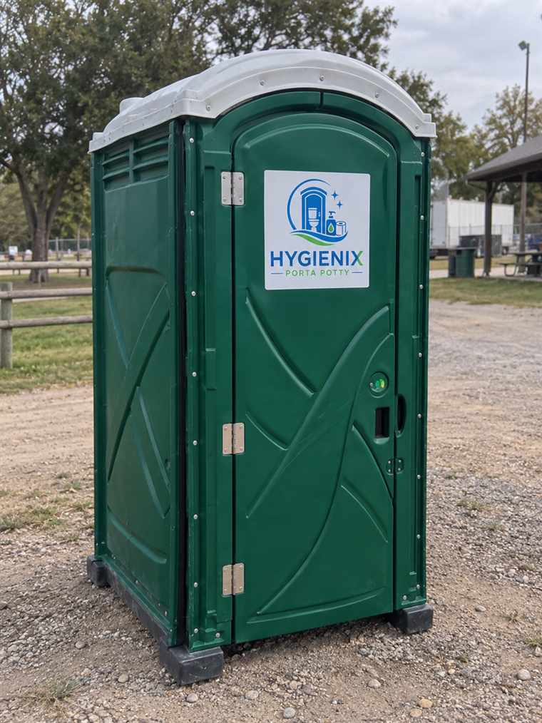 Green Hygienix Porta Potty unit at a park with a picnic shelter